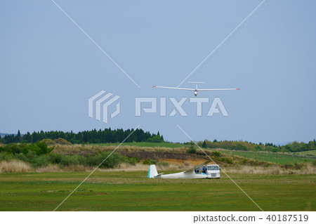 Scenery of the airfield and flight training that exists near Aso mountain high mountain peak of Kumamoto Prefecture (photograph in the person standing permit area) Scenery of the airfield and flight training that exists near Aso mountain high mountain peak of Kumamoto Prefecture (photograph in the person standing permit area) 40187519