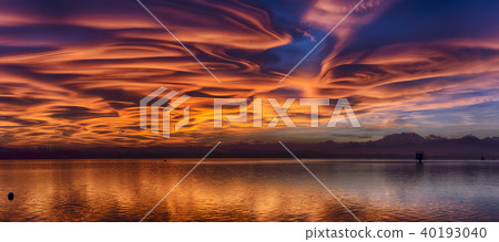 Amazing lenticular clouds at the sunset 40193040