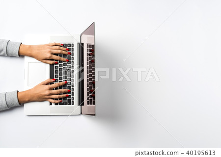 Female hands working on modern laptop Female hands working on modern laptop 40195613