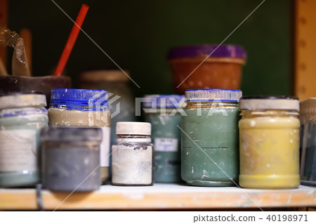 cans of paint on the shelf in the workshop cans of paint on the shelf in the workshop 40198971