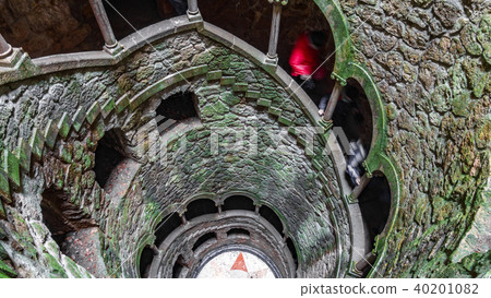 The Initiation Well pattern with blurred tourists descending The Initiation Well pattern with blurred tourists descending 40201082