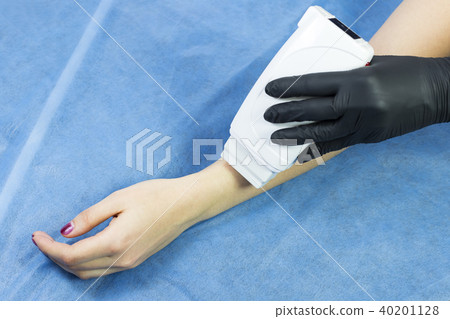Process depilation female legs and hands in a beau 40201128