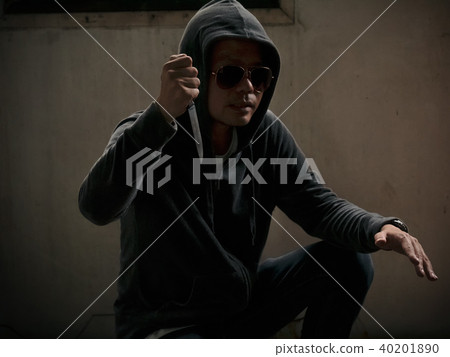 hoody man with a knife in dark room hoody man with a knife in dark room 40201890