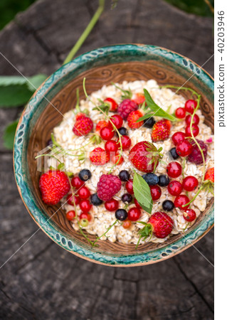 A plate of porridge with berries A plate of porridge with berries 40203946