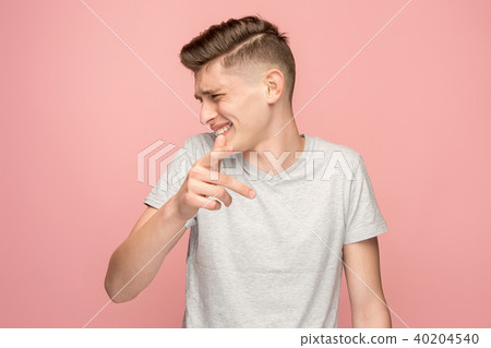 The happy business man point you and want you, half length closeup portrait on pink background. 40204540