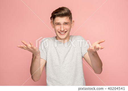 Handsome man looking suprised isolated on pink Handsome man looking suprised isolated on pink 40204541