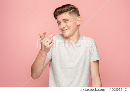 The happy business man standing and smiling against pink background. 40204542