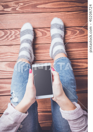 Young woman using smart phone 40206724