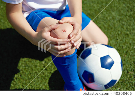 Injury of knee in boy football 40208466