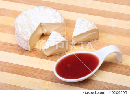Cheese with white mold. Camembert or brie type with Cranberry sauce.. Healthy breakfast. Cheese with white mold. Camembert or brie type with Cranberry sauce.. Healthy breakfast. 40209905