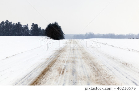 Road in winter weather. straight road Road in winter weather. straight road 40210579