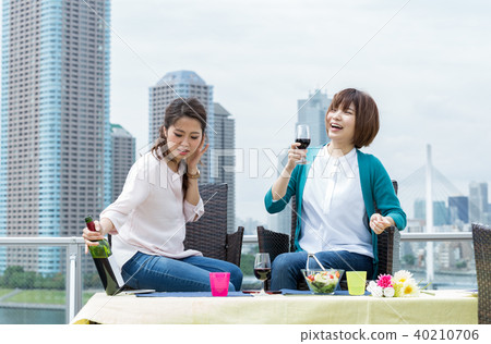 Woman enjoying lunch on the terrace 40210706