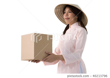 woman in pink dress and vietnam hat holding box 40213796