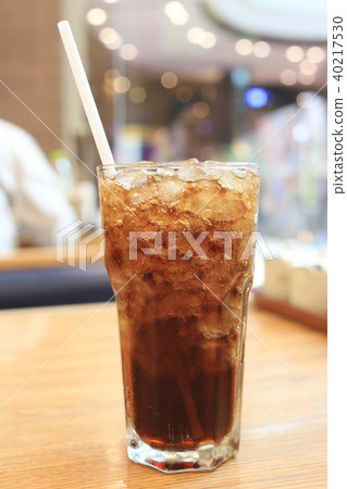 Pop soda glass with ice and a tube. Pop soda glass with ice and a tube. 40217530