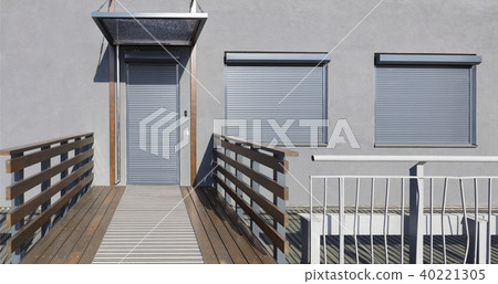 Metal blind on the doors and windows of the facade 40221305