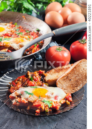 Portion of shakshuka on a plate 40221891