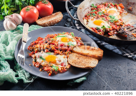 Portion of shakshuka on a plate Portion of shakshuka on a plate 40221896