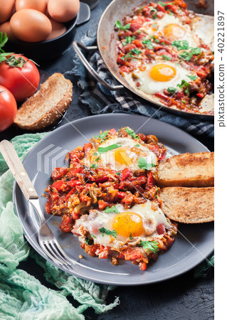 Portion of shakshuka on a plate Portion of shakshuka on a plate 40221897