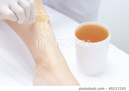 Depilation with wax. Cosmetic procedure. Depilation with wax. Cosmetic procedure. 40223185