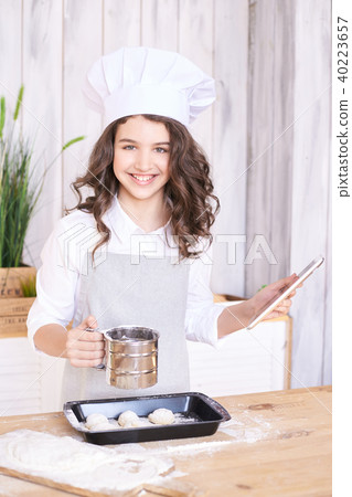 Light wooden background. Cooking buns. 40223657