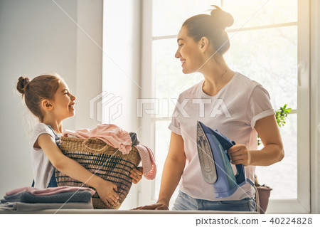 mother and daughter ironing at home mother and daughter ironing at home 40224828