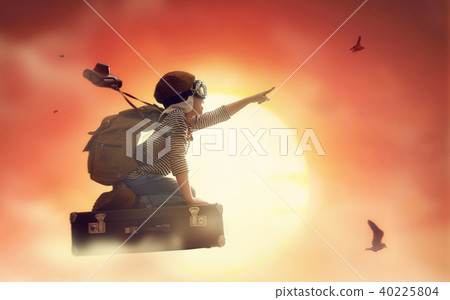Child flying on a suitcase 40225804