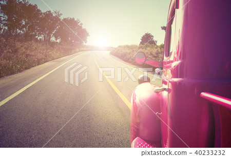 pink retro car on the road pink retro car on the road 40233232