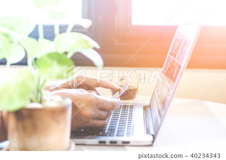 Asian young businessman working on his laptop. Dig 40234343