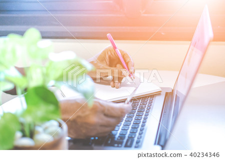 Asian young businessman working on his laptop. Dig Asian young businessman working on his laptop. Dig 40234346