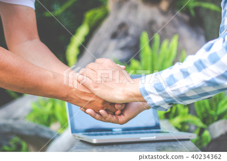 Asian young businessman working on his laptop. Dig 40234362