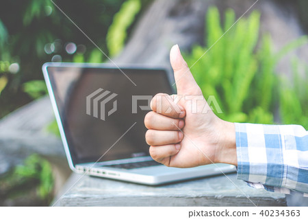 Asian young businessman working on his laptop. Dig 40234363