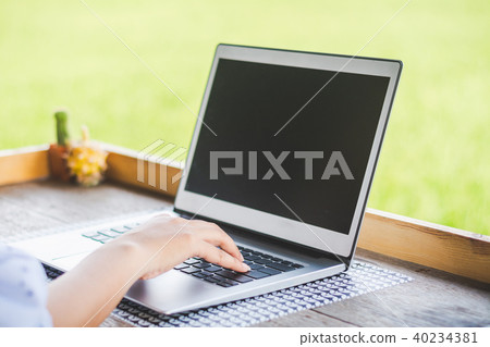 Asian young businessman working on his laptop. Dig Asian young businessman working on his laptop. Dig 40234381