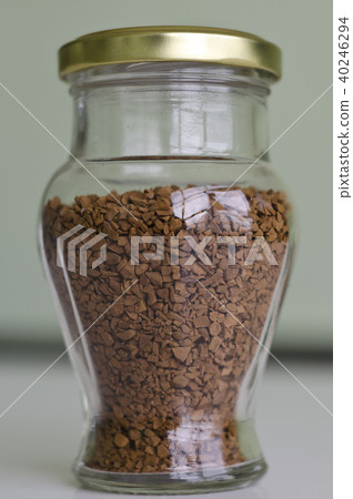 A glass filled with instant coffee 40246294