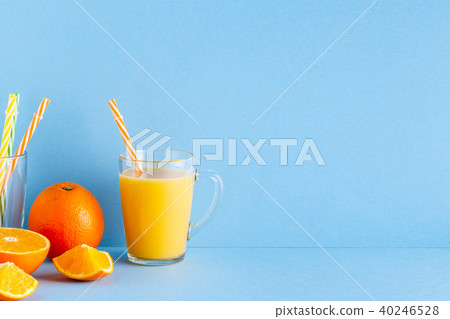 Orange juice on a blue pastel background 40246528