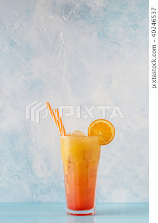 Juicy Orange and Red Tequila Sunrise with ice 40246537