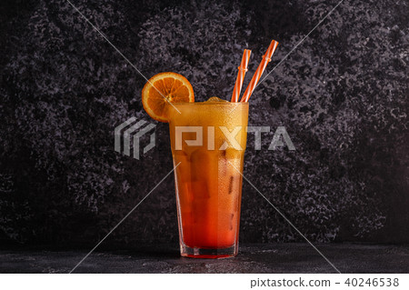 Juicy Orange and Red Tequila Sunrise with ice Juicy Orange and Red Tequila Sunrise with ice 40246538