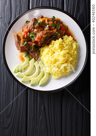 Portion of seco de chivo stewed goat meat Portion of seco de chivo stewed goat meat 40246560