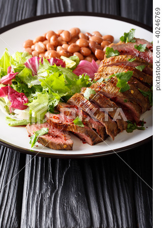 Grilled beef steak with green salad and beans Grilled beef steak with green salad and beans 40246769