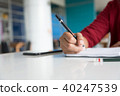 close up Asian woman writing at library. 40247539