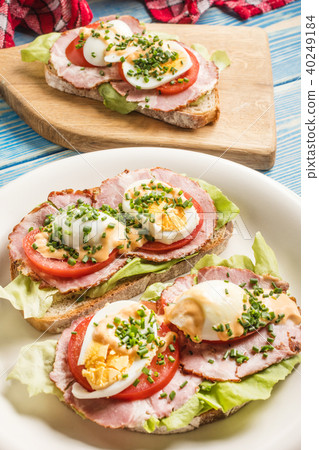 Sandwich with tomatoes, eggs and lettuce. Sandwich with tomatoes, eggs and lettuce. 40249184