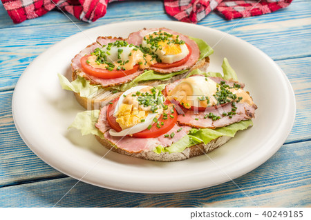 Sandwich with tomatoes, eggs and lettuce. Sandwich with tomatoes, eggs and lettuce. 40249185