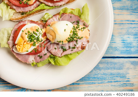 Sandwich with tomatoes, eggs and lettuce. Sandwich with tomatoes, eggs and lettuce. 40249186