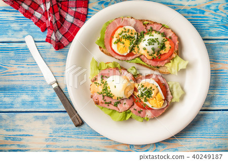 Sandwich with tomatoes, eggs and lettuce. Sandwich with tomatoes, eggs and lettuce. 40249187