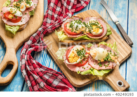 Sandwich with tomatoes, eggs and lettuce. Sandwich with tomatoes, eggs and lettuce. 40249193
