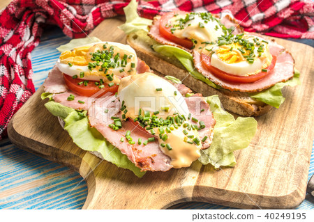 Sandwich with tomatoes, eggs and lettuce. Sandwich with tomatoes, eggs and lettuce. 40249195