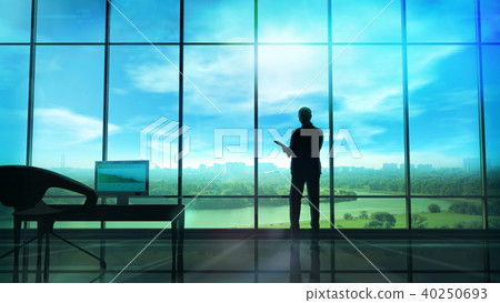 Men in the huge office in front of large windows 40250693