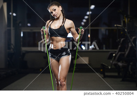 brunette athletic young girl working out in gym brunette athletic young girl working out in gym 40250804