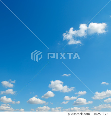 Small white clouds against the blue sky. Small white clouds against the blue sky. 40251178