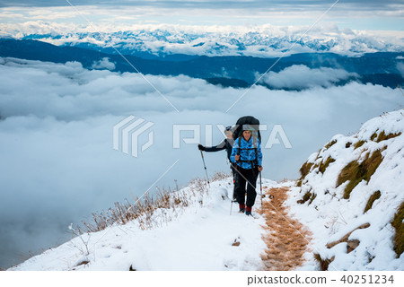 women hiking in mountains women hiking in mountains 40251234