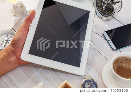 Hand man use tablet smartphone with Office desk Hand man use tablet smartphone with Office desk 40255196